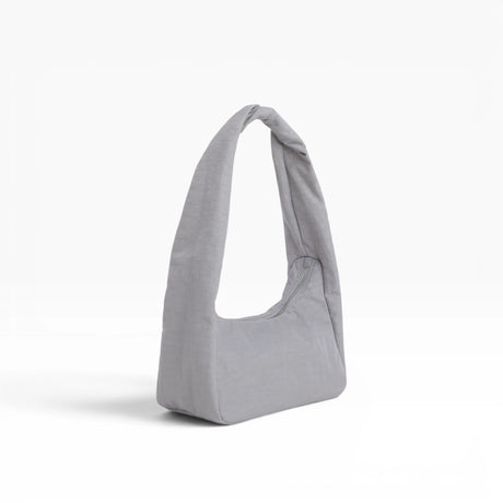 Small fog gray nylon tote bag with top handles and curved shape