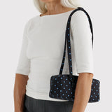 Small bowler bag with black and sky-blue micro dot print, crossbody shoulder straps