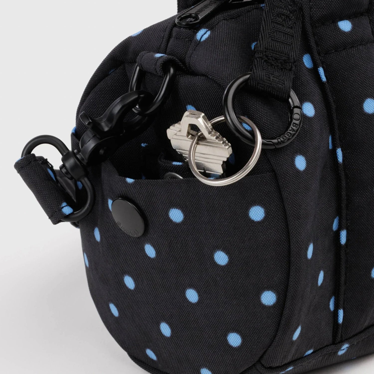 Black and sky blue micro dot small nylon duffle bag hardware detail