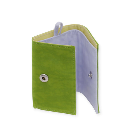 The Baggu Snap Wallet - Green Juice, presented open on a white backdrop, combines style with practicality in a sleek trifold design featuring a secure snap closure.