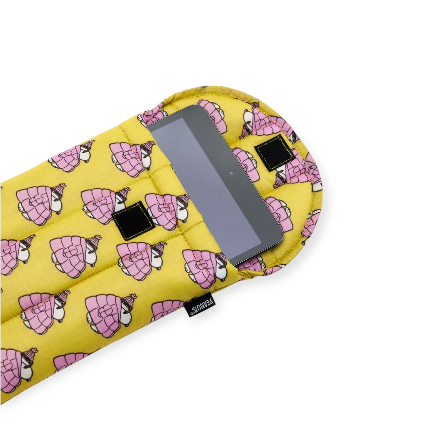 A Peanuts x Baggu Tablet Sleeve - Snoopy Puffer 8" displays a tablet in a vibrant yellow case with playful pink turtle patterns.