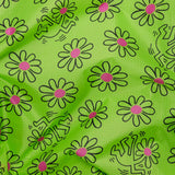 The Baggu Standard Bag - Keith Haring Flower showcases a green fabric decorated with daisies featuring purple centers and black line drawings of dancing figures, inspired by the iconic style of the Baggu x Keith Haring collaboration. Made from recycled nylon yarn, this bag is both stylish and eco-friendly for your everyday needs.