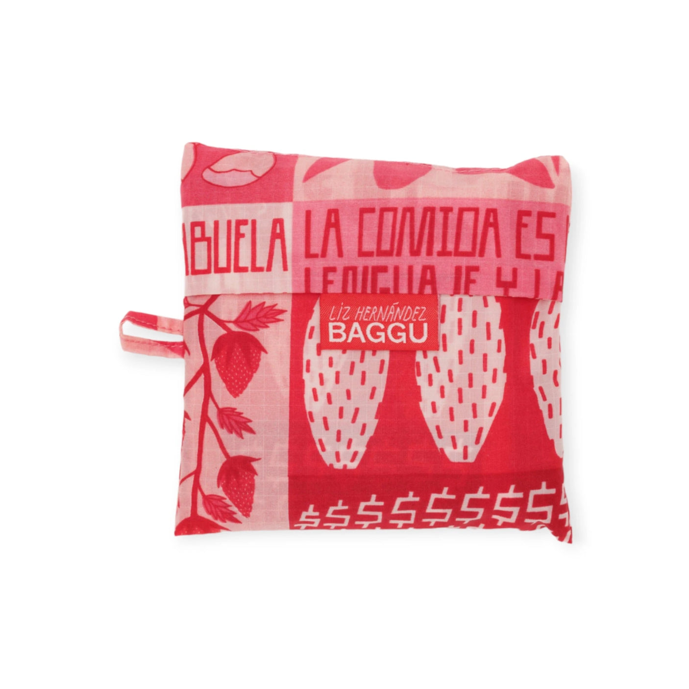 The Baggu Standard Reusable Bag - Mercado by Baggu is a red and pink patterned fabric pouch adorned with strawberries, text, and a label that reads "Liz Hernández BAGGU," crafted from recycled nylon. This stylish accessory takes inspiration from the vibrant Mercado print, blending style and sustainability seamlessly.