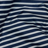 The Baggu Standard Reusable Bag in Navy Stripe showcases a slightly wrinkled texture, echoing the classic navy stripe design.