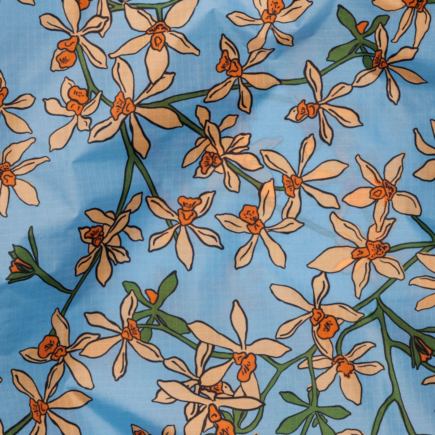 The Baggu Standard Reusable Bag - Orchid features a design of orange and white flowers with green stems on a light blue background, capturing the essence of an Orchid print, and is crafted from recycled nylon.