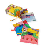 A trio of vibrant, patterned Baggu pouches along with a matching drawstring bag highlights sustainable style in recycled nylon from the Baggu Set of 3 Standard Bags - Still Life.