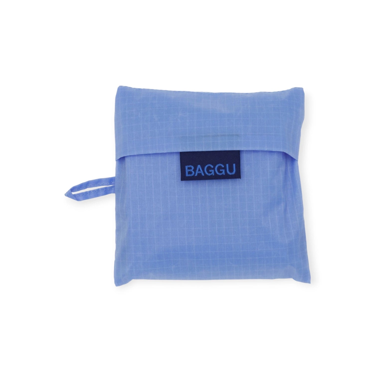 A compact Baggu Standard Reusable Bag in Cornflower, featuring a small handle and a prominent front label, ideal for an eco-friendly lifestyle.