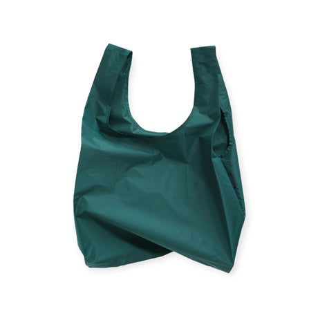 The Baggu Standard Reusable Bag by Baggu is a crumpled shopping bag made from recycled nylon in a rich malachite shade, featuring wide handles against a white backdrop.