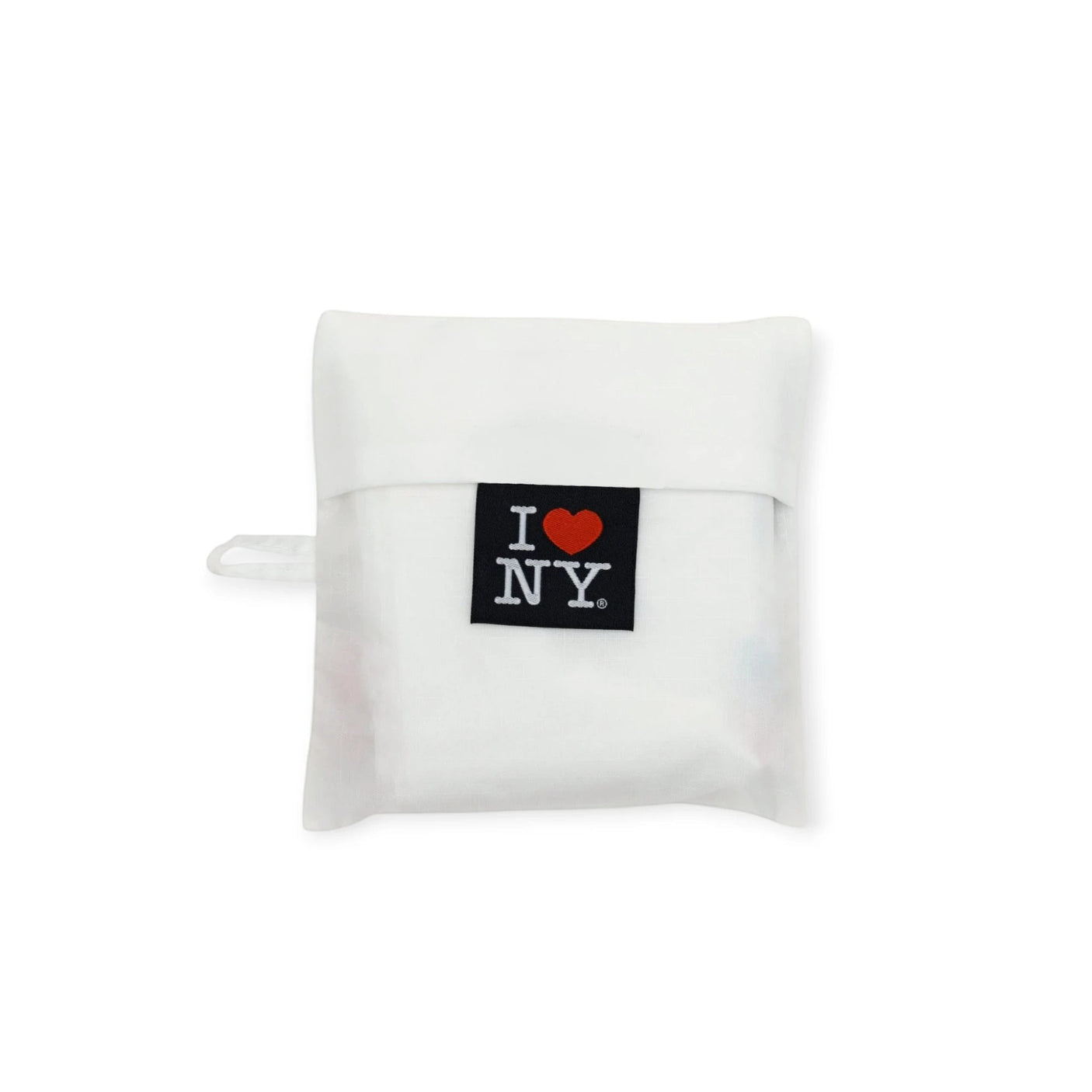 Folded white tote bag with I ♥ NY patch on the front panel