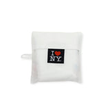 Folded white tote bag with I ♥ NY patch on the front panel