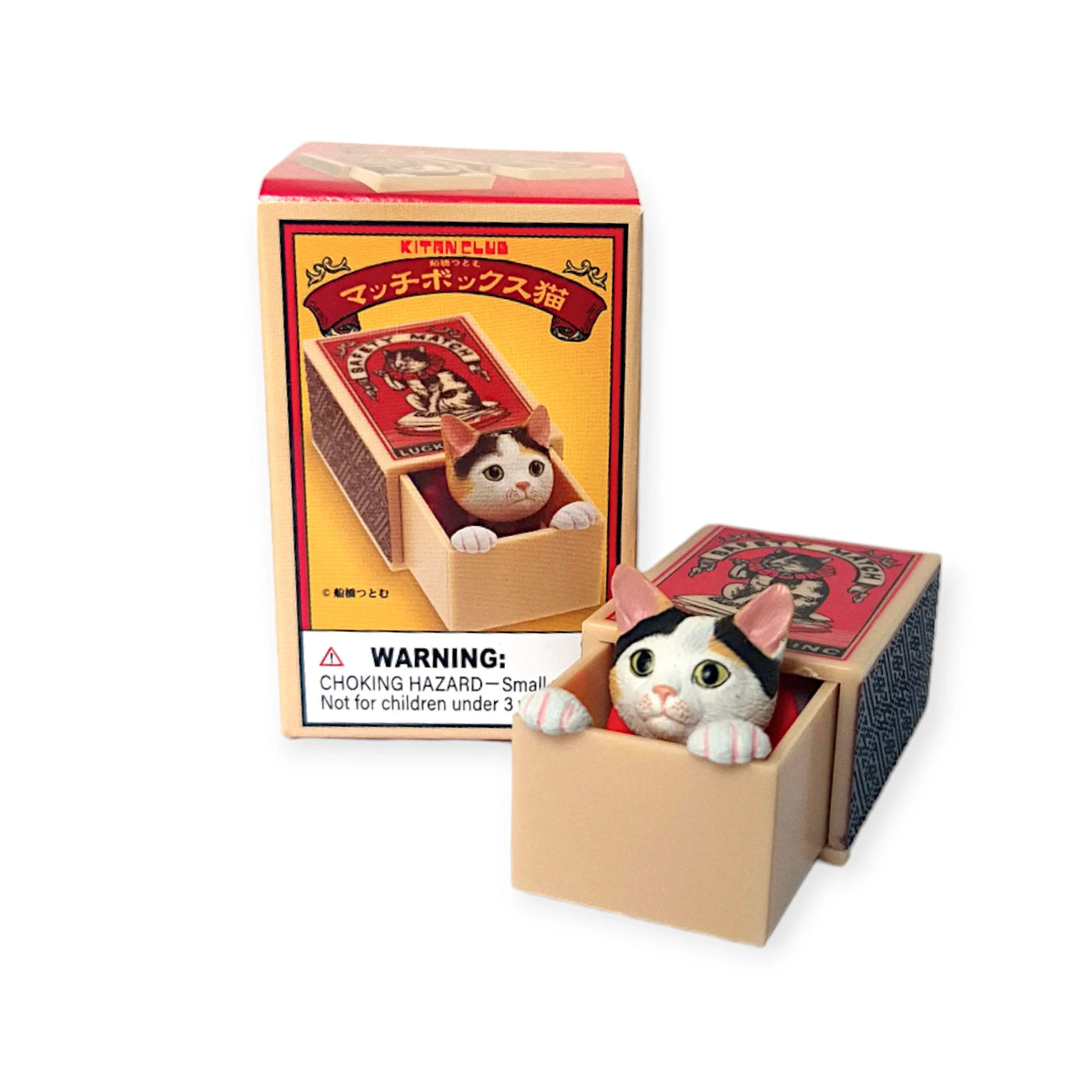 The Cat in a Matchbox Blind Box by Kitan Club features an adorable cat figure that emerges from its matchbox-shaped toy, with packaging that highlights the same enchanting design.