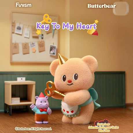 Plush bear with party hat holding large golden key next to small hippo figure in cozy room with bulletin board background