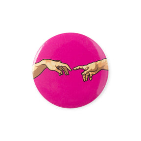 Pink circular button badge with two illustrated hands reaching toward each other