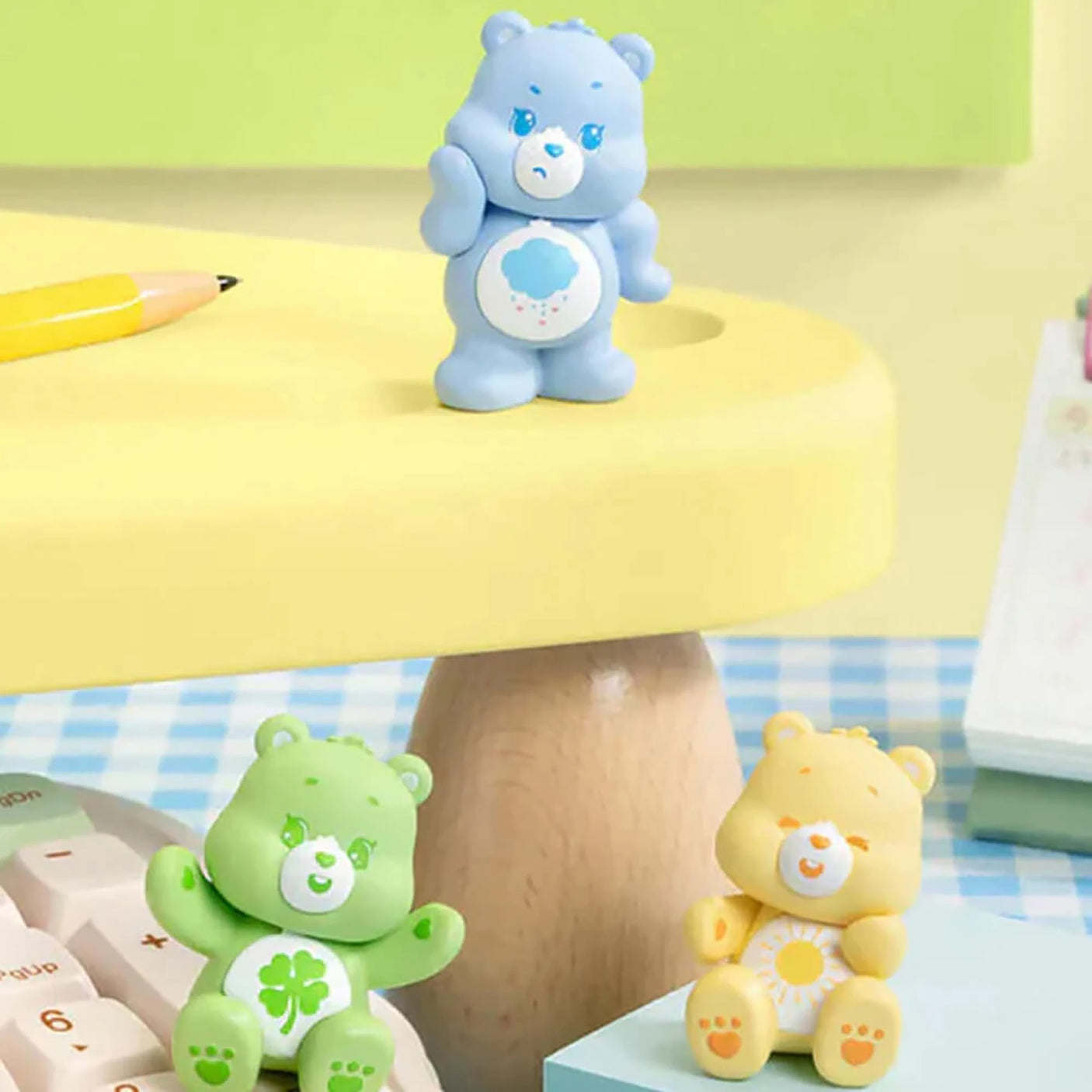 Blue bear mini figure with white belly badge and heart face, standing.