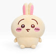 Cute beige plush rabbit with pink cheeks, long ears, and smiling face