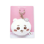 Chiikawa white plush keychain with smiling face and small character charm on pink backing card, front view gallery image 1