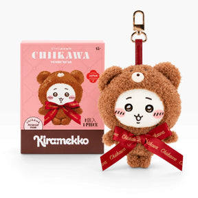 Brown teddy bear plush keychain with red ribbon and metal clip, round smiling face.