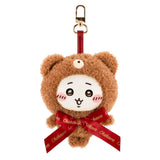 Brown teddy bear plush keychain with red ribbon and metal clip, front face close-up.