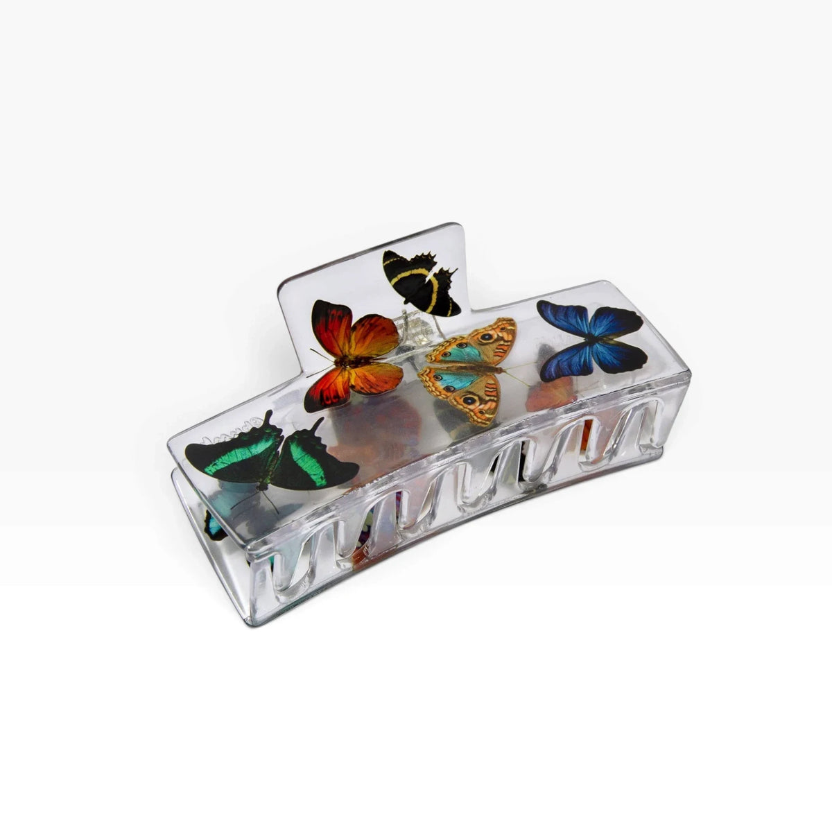 Clear box claw clip with colorful butterfly charms and open prongs