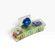 Transparent claw clip with blue and white daisies and red flower detail