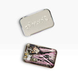Metal bobby pin storage tin with cat charm pins and pink-striped black clips