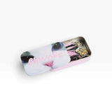 Cat-themed bobby pin tin with pins laid inside, featuring pink striped clips