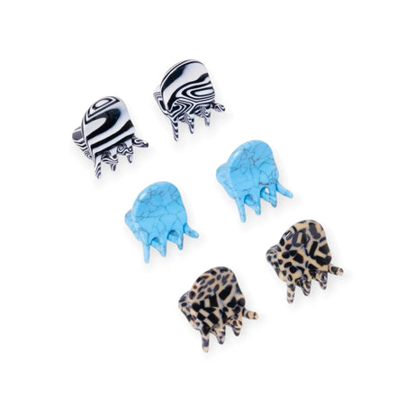 Set of micro claw hair clips: black-and-white zebra, blue marble, leopard prints.
