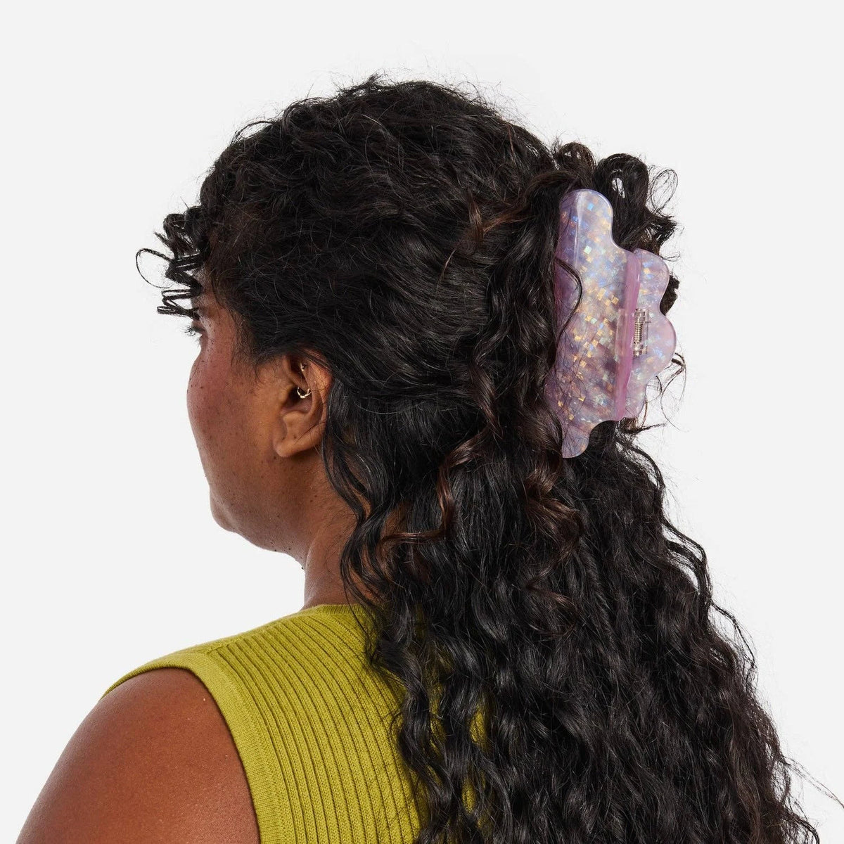Iridescent lilac glitter claw hair clip clipped in dark wavy hair