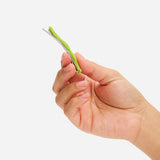 Wavy lime hair slide clip held in hand