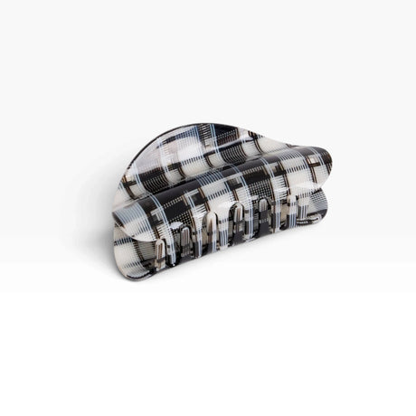 Chunky black-and-white plaid claw clip with ridged grip teeth