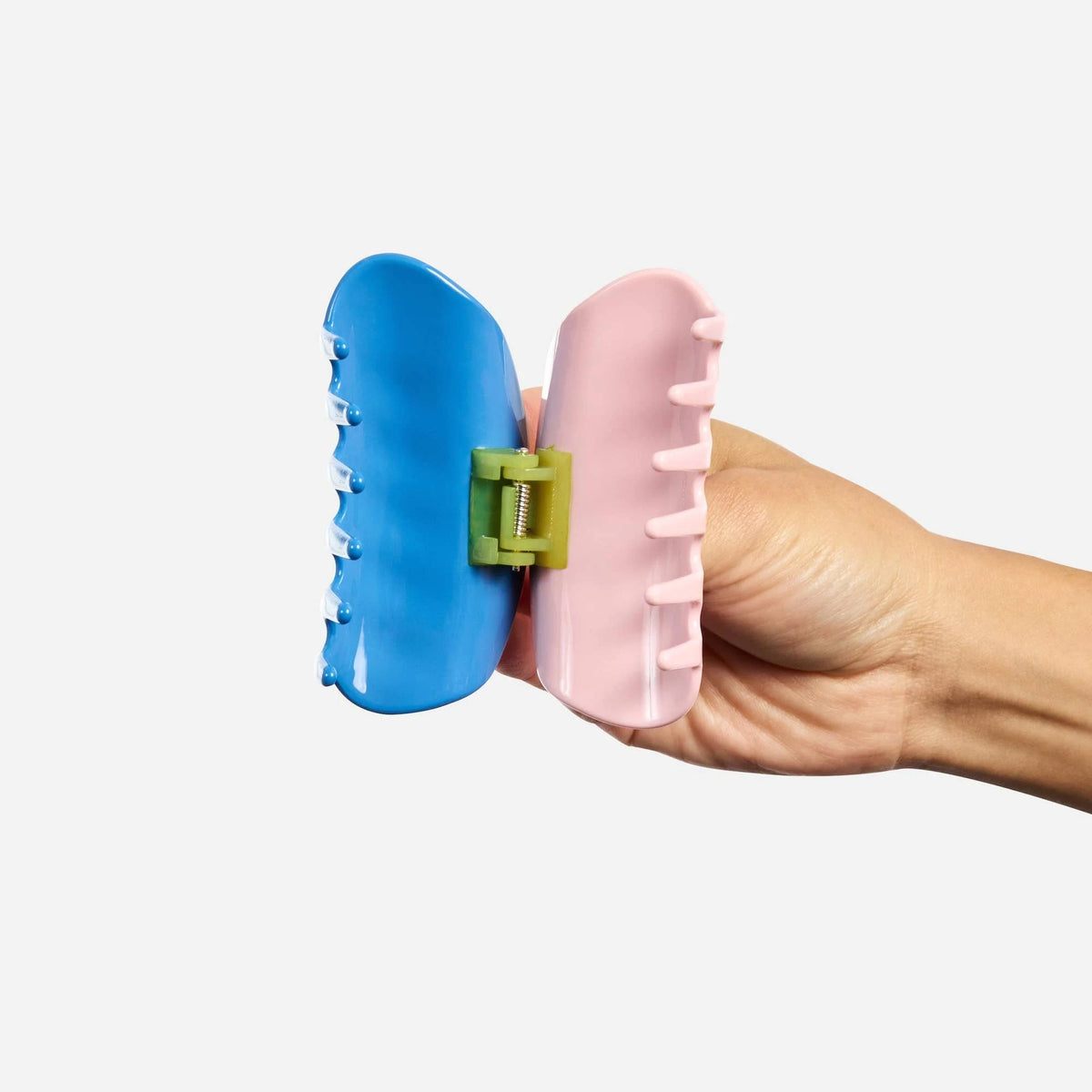 Two-toned blue and pink claw hair clip with gold hinge detail.