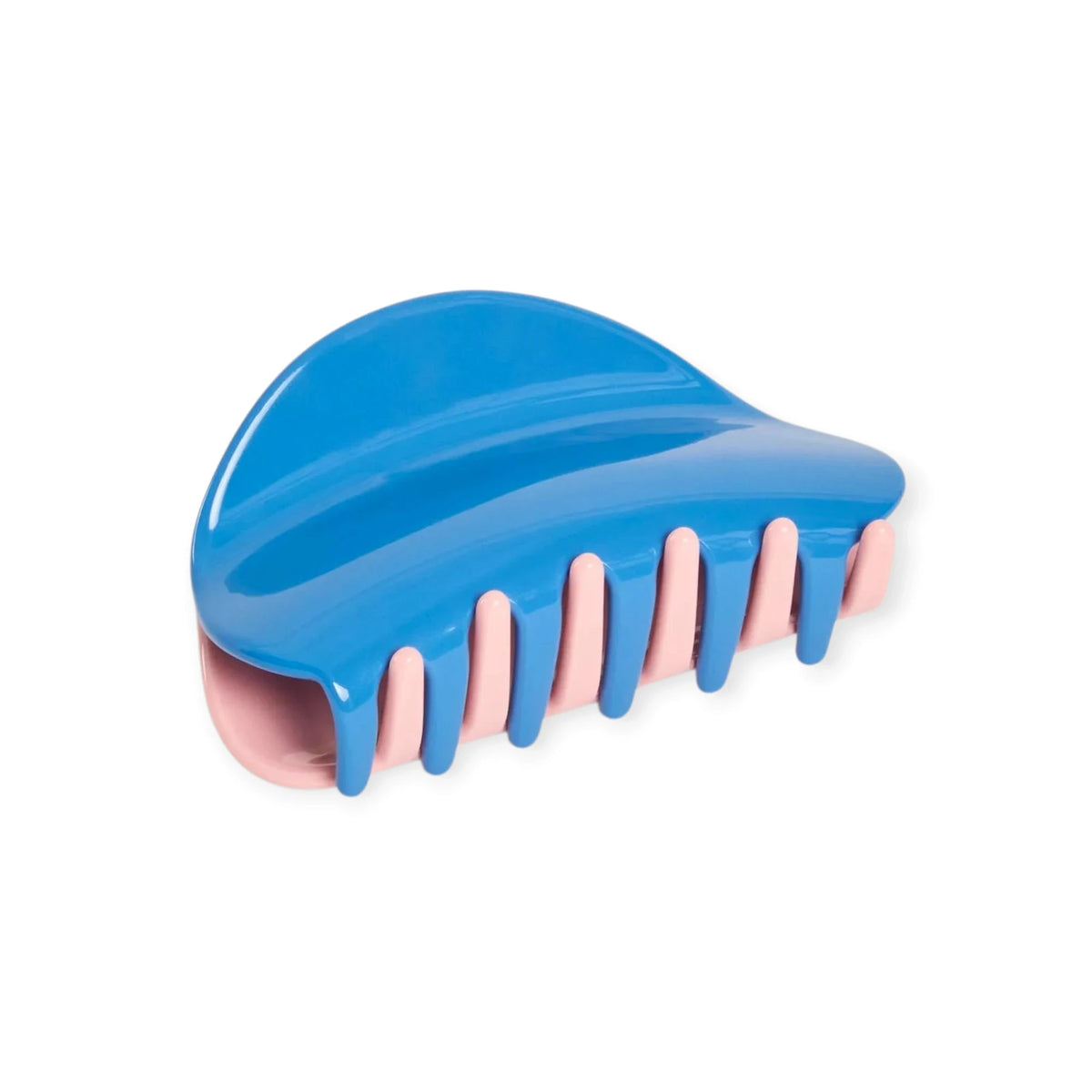 Blue chunky claw hair clip with pale pink ridged teeth, glossy finish.