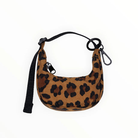 Leopard print Baggu Crescent Bag Charm with black clip and strap, styled flat on white background, gallery image one