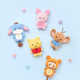 Five plush animal charms in assorted colors, including pink bunny and blue dog figures.