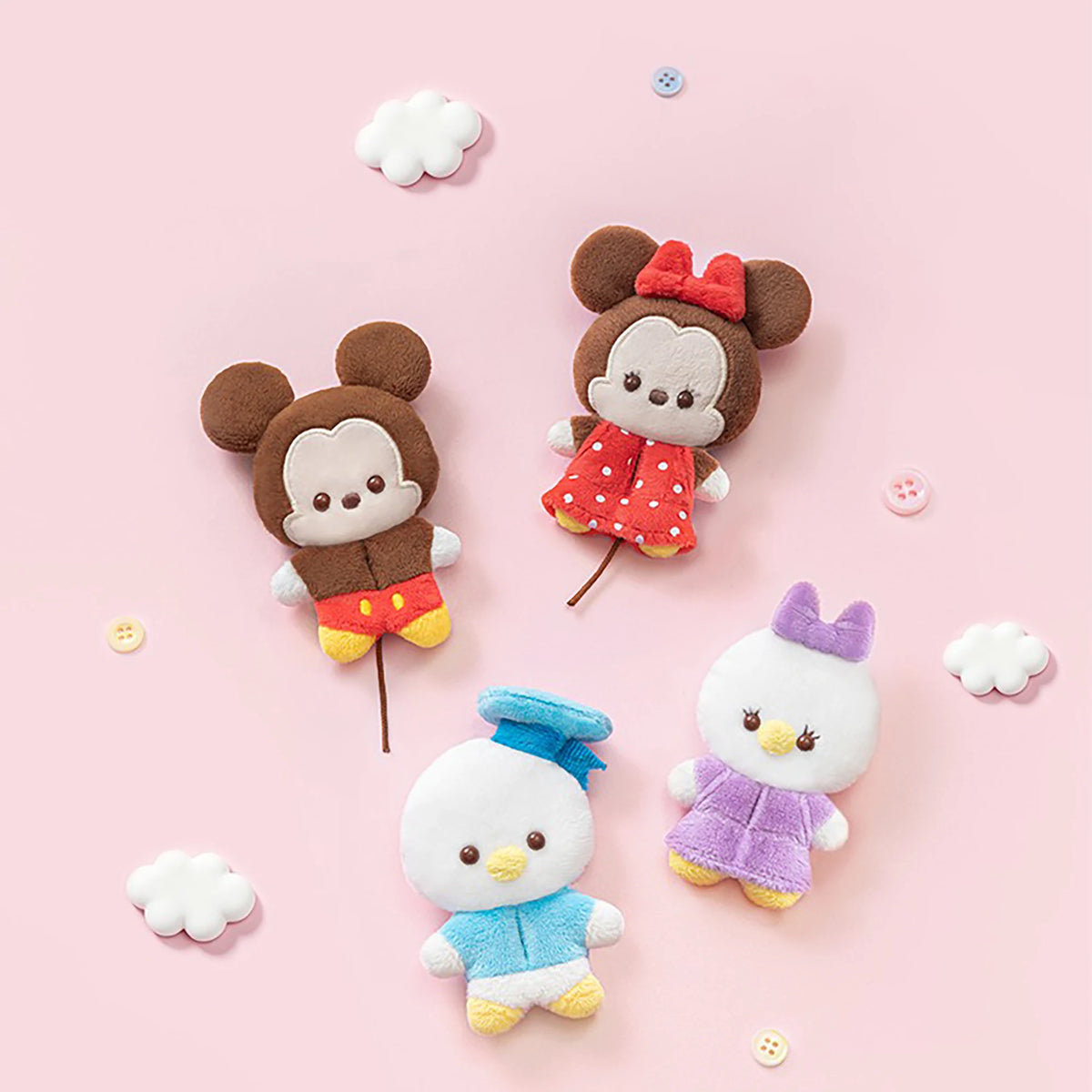 Set of five small plush animal charms with colorful outfits and stitched faces.
