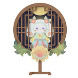 A stylized character from the "Lucky EMMA - Secret Forest of Dim Lights Series Blind Box," featuring pastel colors, stands behind a wooden circular frame adorned with floral designs, set against a dark background illuminated by a moon and sparkles, unveiling an enchanting Blind Box experience.