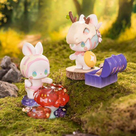 Chibi collectible figures: white-and-pink bunny with a red accessory beside a purple cup