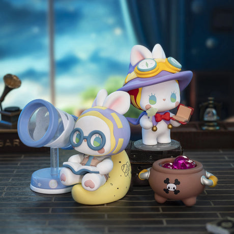 Chibi collectible figures with glasses, egg-shaped base, and a cauldron accessory