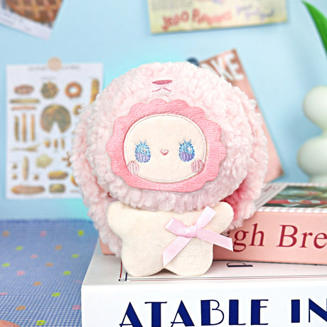 The Lucky Emma Fuzzy Family Keychain Blind Box features a plush toy with a pink fluffy hood, embroidered blue eyes, and a pink bow—perfect as a cute keychain or bag charm to add to your collection.