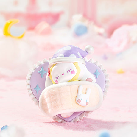 Sleeping Emma Secret Forest Love Dopamine figure in purple nightcap holding a pink bunny pillow on a pastel pink background