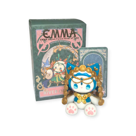 A cute cat figurine with ornate gold details sits in front of a decorative "Lucky EMMA - Secret Forest River of Time" blind box by Lucky Emma, perfect for fans of the River of Time series.