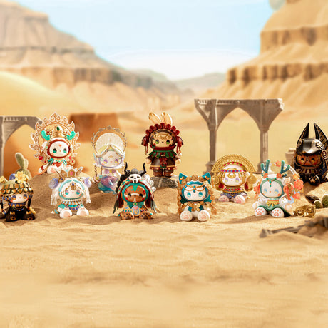 A set of eleven intricately designed decorative figurines from the Lucky Emma Secret Forest River of Time Blind Box is displayed in a sandy desert scene, with ancient ruins softly blurred in the background.