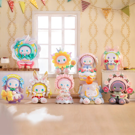 A set of vibrant, hand-painted, animal-themed figurines from the Lucky EMMA - Secret Forest Birthday Party Blind Box collection by Lucky Emma is displayed in two rows near a window, adorned with pastel-colored decorations.