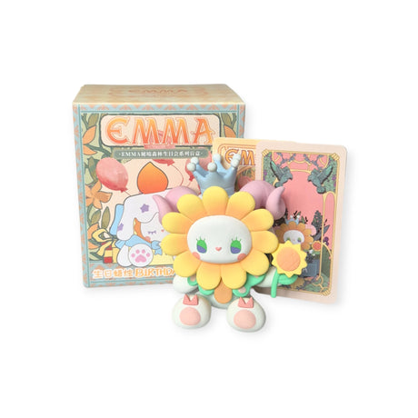 A vibrant Lucky EMMA figure from the Secret Forest Birthday Party Blind Box, featuring a flower head, crown, and smiling face, stands happily in front of a coordinating box and card embellished with floral patterns. This hand-painted figure adds charm to any celebration and is ideal for a Secret Forest Birthday Party.