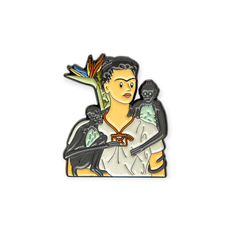 Close-up of enamel pin depicting Frida Kahlo with two monkeys and tropical flower, gallery image 1, file 4.webp