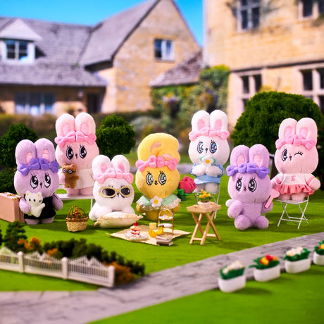 Eight colorful Esther Bunny plush toys with bows enjoying an outdoor garden picnic with tea and snacks