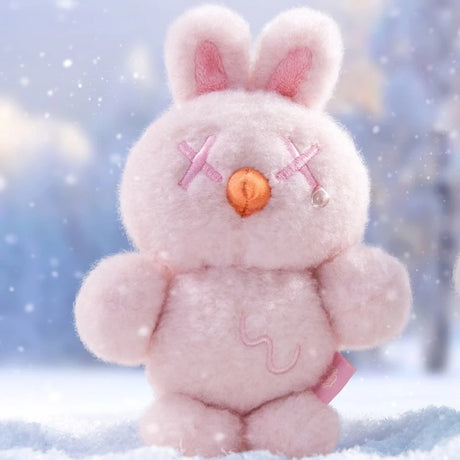 Pink bunny plush from Finding Unicorn Shinwoo Cold Hugs Blind Box with stitched X eyes and orange nose in snowy background