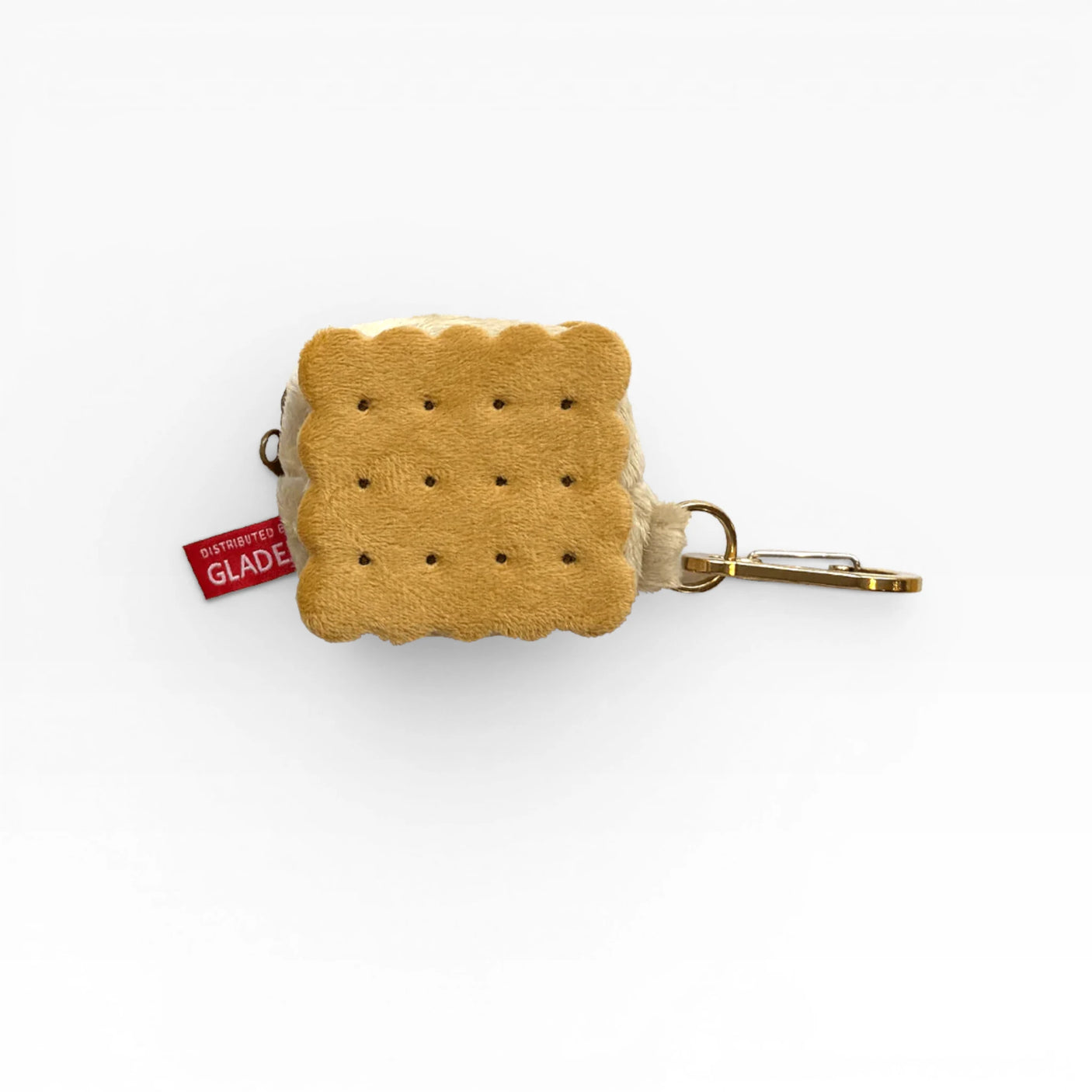 Plush cookie-shaped AirPods case with dotted face and metal carabiner clip