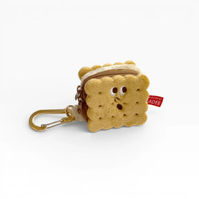 Plush cookie-shaped AirPods case with zipper and metal carabiner clip