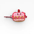 Strawberry plush AirPods case with cartoon face, red metal clip and strap